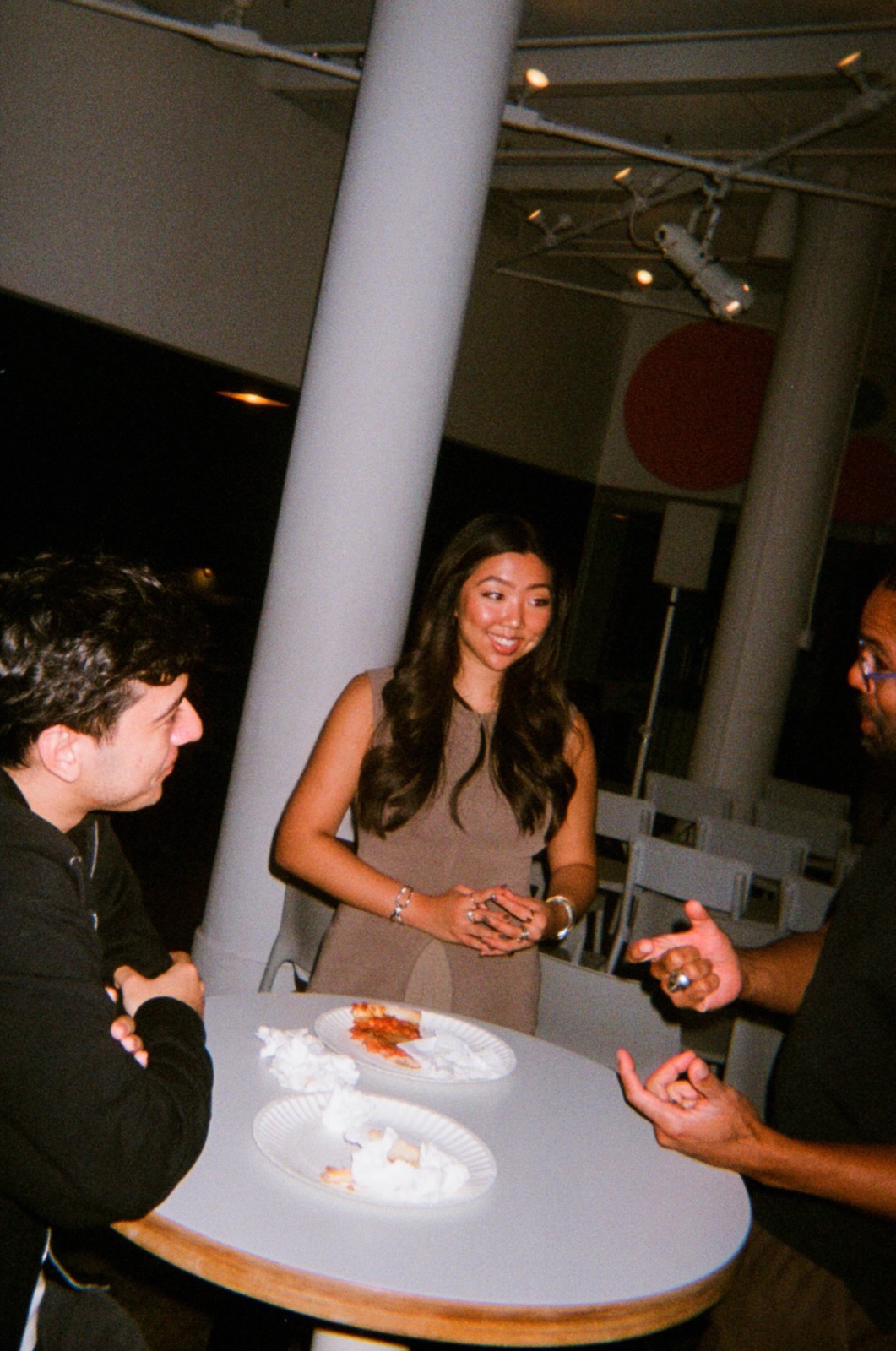 Guests gathered around a table at Ophelia Demo Night